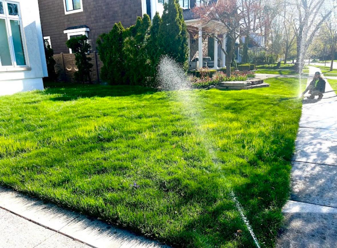 Active sprinkler system running at a colonial home in Metro Detroit — Elite Sprinkler Systems spring start-up service.
